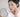 ผู้หญิงส่องกระจกดูฝ้าบนแก้ม / woman looking in a mirror at melasma patches on her cheek