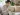วิธีแก้ปวดเข่า — ผู้หญิงนั่งจับเข่าที่ปวดบนโซฟาที่บ้าน