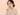 ผู้หญิงส่องดูแผลร้อนในที่ริมฝีปาก — ร้อนในเกิดจากอะไร วิธีดูแลให้บรรเทาเร็ว
