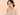 ผู้หญิงส่องดูแผลร้อนในที่ริมฝีปาก — ร้อนในเกิดจากอะไร วิธีดูแลให้บรรเทาเร็ว
